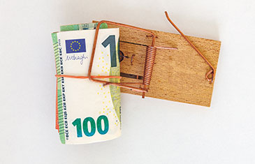 Symbolbild eines 100-Euro-Geldscheins in einer Mäusefalle